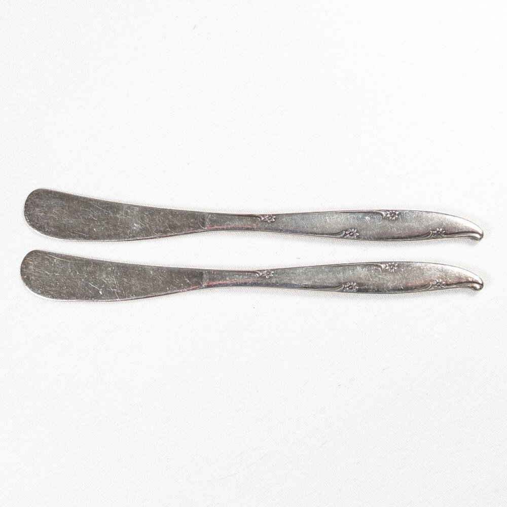 Pair of dainty floral butter knives